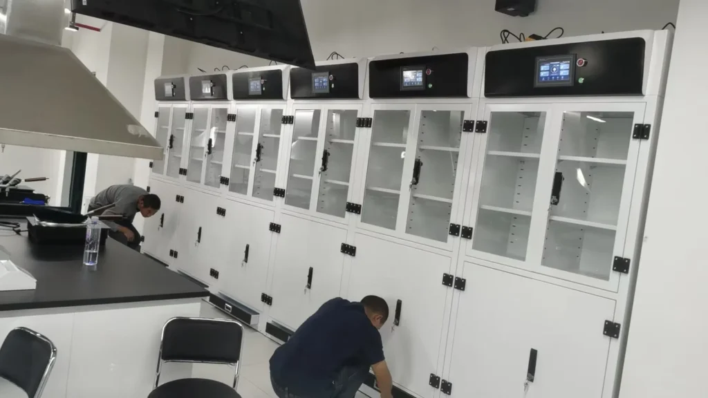 Leak containment sump inside hazardous chemical storage cabinet